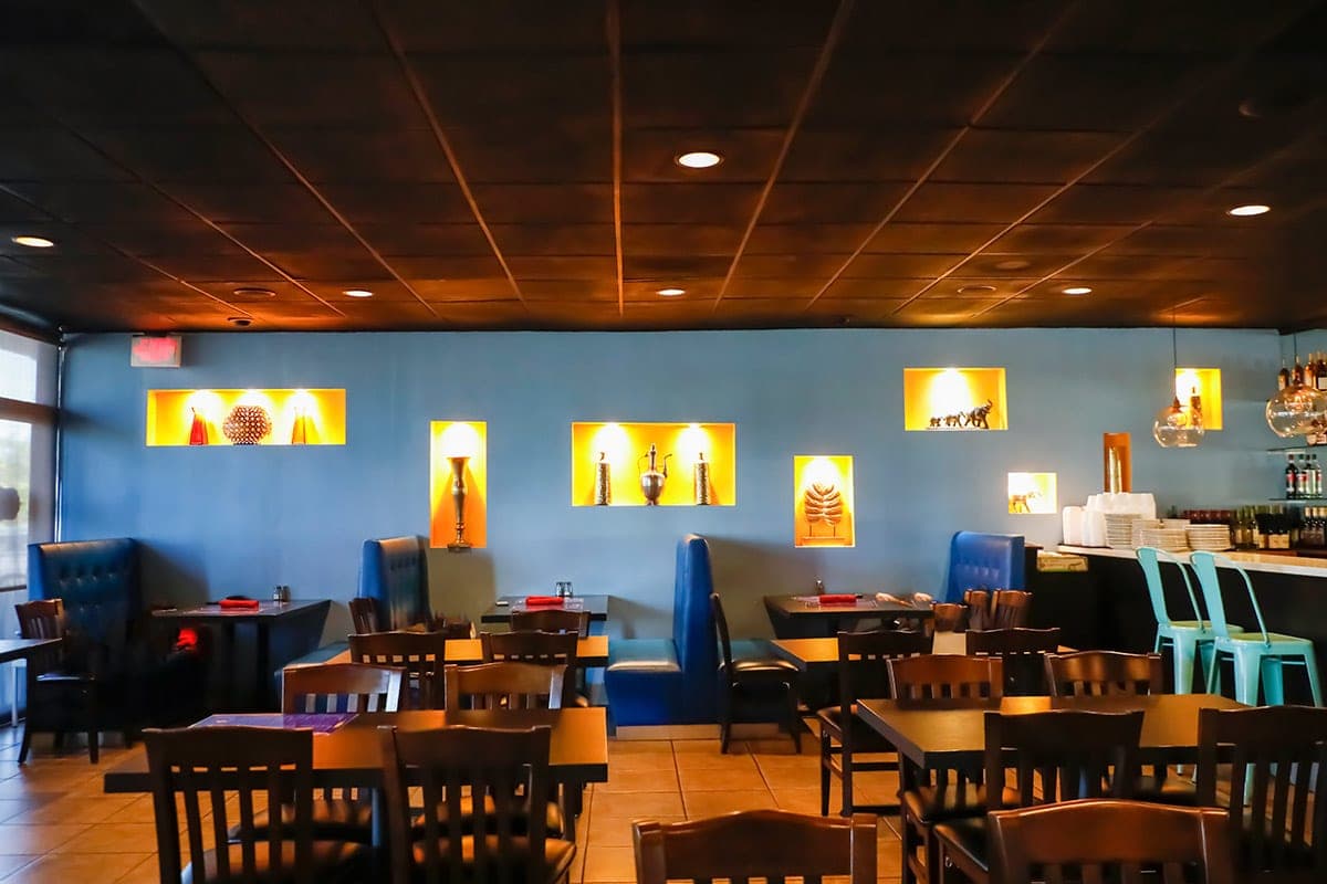 Blue booth seating and decorative wall niches